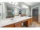 Bright bathroom featuring a double sink vanity, tub, and separate shower at 15001 Arrowgrass Way, Charlotte, NC 28278