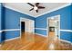 Open-concept living area with hardwood floors and access to other rooms at 15001 Arrowgrass Way, Charlotte, NC 28278