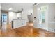 Bright living room featuring a view to the kitchen and a door to an outdoor deck at 15001 Arrowgrass Way, Charlotte, NC 28278