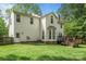 Charming two-story home with a spacious backyard, wooden deck, and lush landscaping at 15001 Arrowgrass Way, Charlotte, NC 28278
