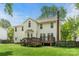Charming two-story home with a spacious backyard, wooden deck, and lush landscaping at 15001 Arrowgrass Way, Charlotte, NC 28278