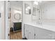 Well lit bathroom with double sink vanity and access to the main bedroom at 1555 Ridgewood Dr, Gastonia, NC 28054