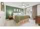 Bright bedroom featuring stylish decor, ceiling fan, and natural light streaming through the window at 1555 Ridgewood Dr, Gastonia, NC 28054