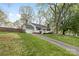 Inviting home featuring a large front yard and an attached garage at 1555 Ridgewood Dr, Gastonia, NC 28054