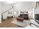 Open-concept living room boasting high ceilings, a fireplace, and seamless flow to the dining area at 1555 Ridgewood Dr, Gastonia, NC 28054