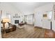 Inviting living room featuring hardwood floors, a cozy fireplace, and ample natural light at 1555 Ridgewood Dr, Gastonia, NC 28054