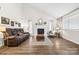 Spacious living room with hardwood floors, a fireplace, and modern decor, creating an inviting atmosphere at 1555 Ridgewood Dr, Gastonia, NC 28054