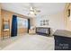 Well-lit main bedroom features a ceiling fan, large window, and a classic crib at 1555 Ridgewood Dr, Gastonia, NC 28054