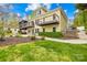 Expansive backyard featuring a multi-level deck, manicured lawn, and lush landscaping at 158 Regency Rd, Mooresville, NC 28117