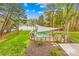 Lakefront backyard features a hot tub with a gazebo and a fire pit at 158 Regency Rd, Mooresville, NC 28117