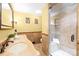 Neutral toned bathroom features a marble shower and double sinks with a marble countertop at 158 Regency Rd, Mooresville, NC 28117