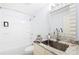 Bright bathroom features a modern vanity, large mirror, and a shower-tub combination at 158 Regency Rd, Mooresville, NC 28117