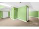 Spacious bonus room with multiple doors, neutral carpet, and ample natural light at 158 Regency Rd, Mooresville, NC 28117