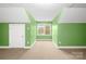 Bonus room features neutral carpet and a window with natural light at 158 Regency Rd, Mooresville, NC 28117