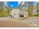 Exterior of the large garage with a gravel driveway and an open door showcasing storage at 158 Regency Rd, Mooresville, NC 28117