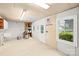 Spacious garage interior with ample storage space, featuring natural light from a window and door at 158 Regency Rd, Mooresville, NC 28117