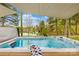 A luxurious outdoor hot tub with a lake view, wine, and a relaxing canopy at 158 Regency Rd, Mooresville, NC 28117