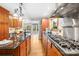 Well-appointed kitchen with stone countertops, professional grade appliances, and custom cabinetry at 158 Regency Rd, Mooresville, NC 28117