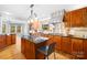 Chef's kitchen boasts granite counters, stainless appliances, custom cabinets, and gas range at 158 Regency Rd, Mooresville, NC 28117
