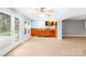 Open room featuring tile floors and a built in bar with cabinets and windows at 158 Regency Rd, Mooresville, NC 28117
