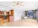 Open concept living area with adjacent kitchen featuring bar seating, hardwood cabinets at 158 Regency Rd, Mooresville, NC 28117