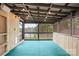 Screened-in porch with wood features, lake views and wood plank walls and ceiling at 158 Regency Rd, Mooresville, NC 28117