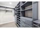 Custom designed walk-in closet features many shelves and drawers for optimal storage at 158 Regency Rd, Mooresville, NC 28117