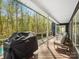 Covered deck with grill and patio seating, providing a relaxing outdoor space at 1725 Hannon Farm Rd, Fort Mill, SC 29715