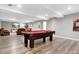 Spacious finished basement with a pool table, living area, and laminate floors at 1725 Hannon Farm Rd, Fort Mill, SC 29715