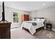 Comfortable bedroom with neutral tones, soft carpeting, and ample natural light at 1725 Hannon Farm Rd, Fort Mill, SC 29715