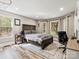 Cozy bedroom with natural light, complemented by wood-look floors and neutral decor at 1725 Hannon Farm Rd, Fort Mill, SC 29715