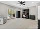 Bright bedroom featuring double doors to pool area, a ceiling fan, and a workspace at 1725 Hannon Farm Rd, Fort Mill, SC 29715