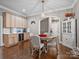 Charming dining area featuring hardwood floors, an elegant chandelier, and a built-in buffet with a wine cooler at 1725 Hannon Farm Rd, Fort Mill, SC 29715