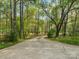 Long concrete driveway surrounded by trees, leading to the home at 1725 Hannon Farm Rd, Fort Mill, SC 29715