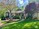 Beautifully landscaped home with a well-manicured lawn and a charming stone walkway leading to the front entrance at 1725 Hannon Farm Rd, Fort Mill, SC 29715