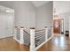 Inviting foyer with hardwood floors, modern railings, and a view of the front door with decorative glass insert at 1725 Hannon Farm Rd, Fort Mill, SC 29715