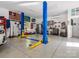 Garage interior featuring a two-post car lift and many tools and accessories at 1725 Hannon Farm Rd, Fort Mill, SC 29715