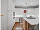 Modern kitchen with white cabinets, quartz countertops, stainless steel appliances, and hardwood floors with ample storage at 1725 Hannon Farm Rd, Fort Mill, SC 29715