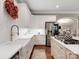 Bright kitchen featuring white cabinets, stainless steel appliances, and farmhouse sink with modern fixtures at 1725 Hannon Farm Rd, Fort Mill, SC 29715