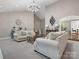 Bright and airy living room with plush seating, high ceilings, and elegant chandelier at 1725 Hannon Farm Rd, Fort Mill, SC 29715
