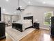 Inviting main bedroom with vaulted ceiling, hardwood floors, and ample natural light from large windows at 1725 Hannon Farm Rd, Fort Mill, SC 29715