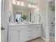 Bright bathroom with double sink vanity, large mirror, and modern fixtures at 2014 Puddle Pond Rd, Indian Trail, NC 28079