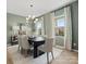 Elegant dining room featuring modern chandelier and large windows with natural light at 2014 Puddle Pond Rd, Indian Trail, NC 28079