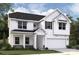 Charming two-story white home with a covered porch and attached two-car garage at 2014 Puddle Pond Rd, Indian Trail, NC 28079