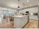 Open-concept kitchen featuring a large island, stainless appliances, and ample counter space at 2014 Puddle Pond Rd, Indian Trail, NC 28079