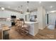 Modern kitchen with stainless appliances and center island with seating for four at 2014 Puddle Pond Rd, Indian Trail, NC 28079