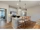 Bright kitchen with stainless appliances, center island, and four bar stools at 2014 Puddle Pond Rd, Indian Trail, NC 28079