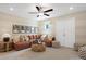 Cozy living room with plush seating, soft lighting, and ceiling fan at 2014 Puddle Pond Rd, Indian Trail, NC 28079