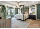 Spacious main bedroom with a tray ceiling, large windows, and ample natural light at 2014 Puddle Pond Rd, Indian Trail, NC 28079