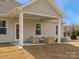 Covered patio with outdoor seating area and a view of the backyard at 2014 Puddle Pond Rd, Indian Trail, NC 28079
